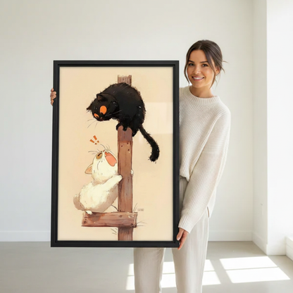 Woman holding large framed funny black cat spooking white cat wooden post Japanese style wall art print in black frame showing actual print size in bright minimalist white studio
