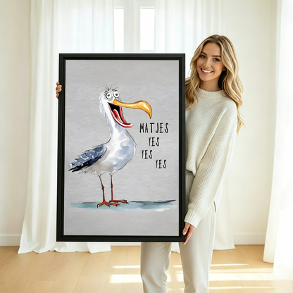 Woman holding large funny seagull framed canvas print – 'Matjes Yes Yes Yes' coastal humor wall art in black frame perfect as beach house or kitchen gift