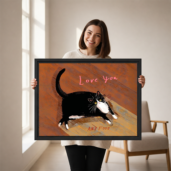 Smiling woman holding large funny cat Love You and Food framed canvas print to show size in bright living room