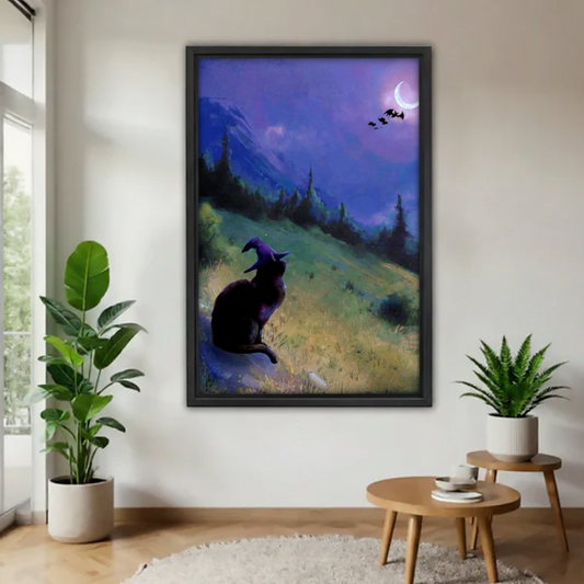 Mystical black cat witch hat moon night framed wall art in bright living room with fiddle leaf fig