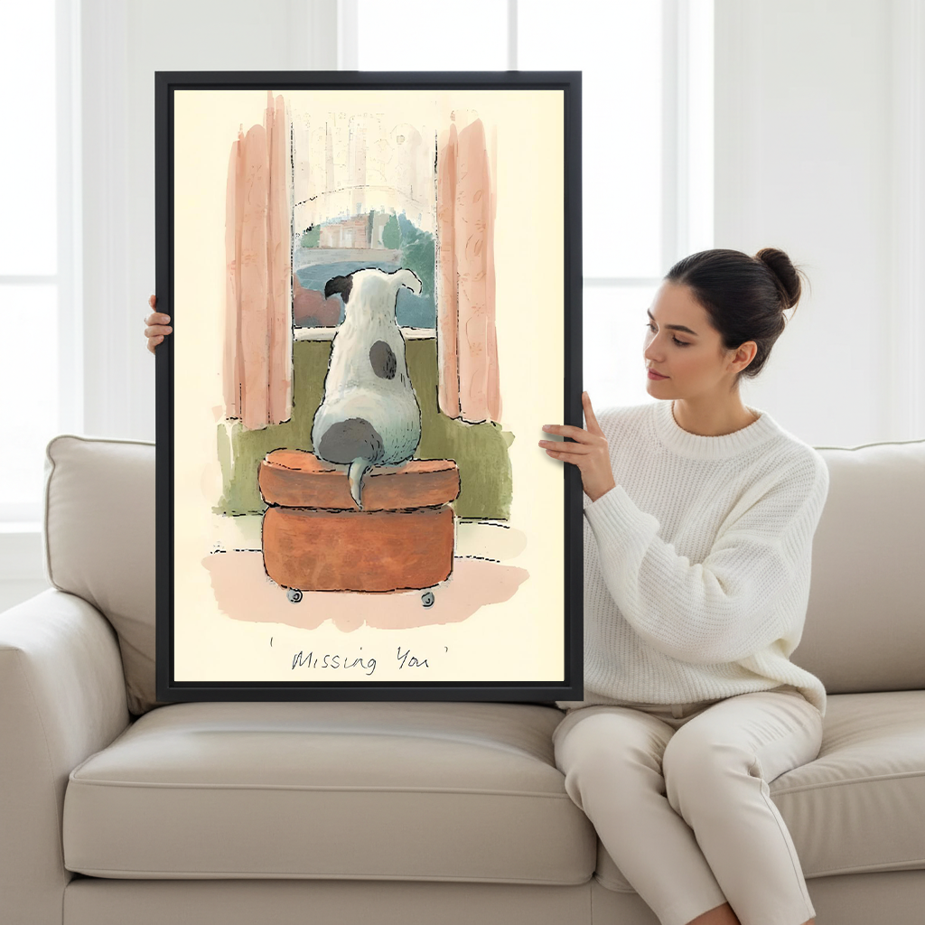 Woman holding large Missing You framed dog watercolor print to show size on white sofa