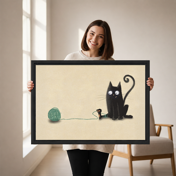 Woman holding cute black cat yarn ball framed canvas print – whimsical wall art gift for cat lovers
