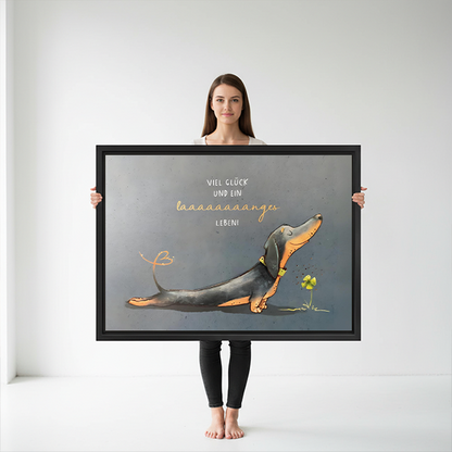 Woman holding large funny dachshund framed canvas print showing size reference