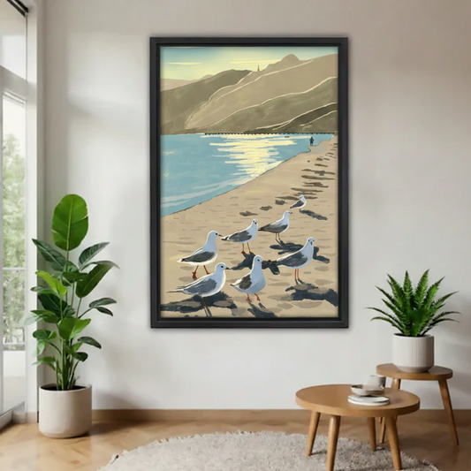 Black framed coastal seagulls beach canvas print in modern living room with tropical plants