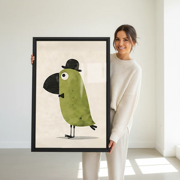 Woman holding a large framed whimsical dapper bird gentleman wall art print in a bright white studio