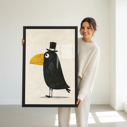 Woman holding a large framed whimsical dapper toucan top hat wall art print in a bright white studio