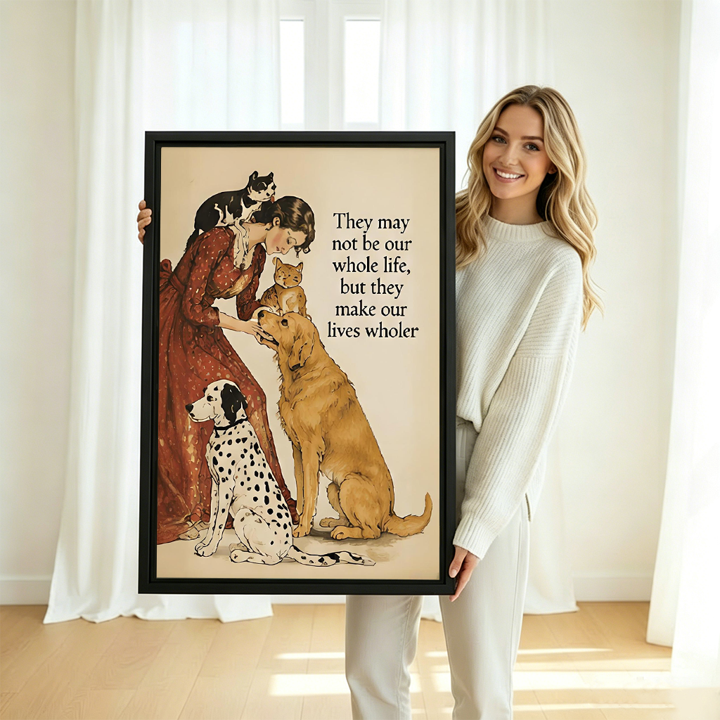 Smiling blonde woman in white sweater holding large lives wholer woman cats dogs vintage watercolor framed canvas print with dalmatian golden retriever orange cat and black white cat in bright white room with sheer curtains and natural light