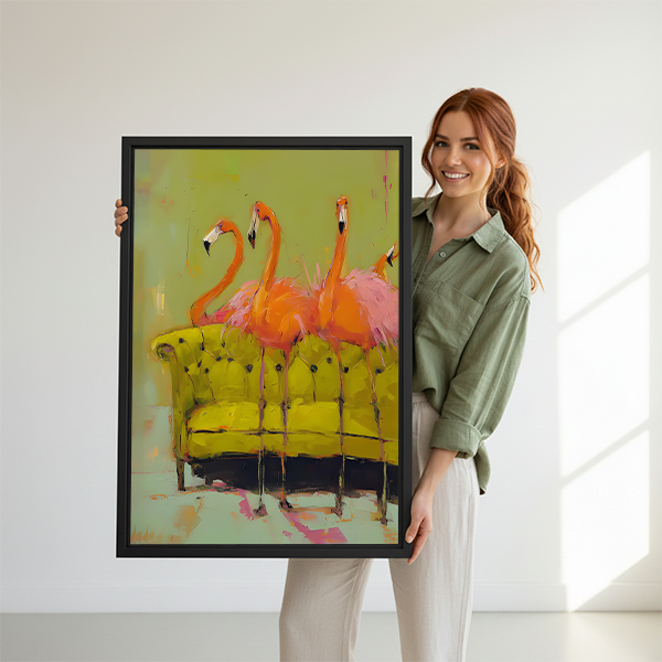 Woman holding a framed pink flamingos abstract canvas wall art print