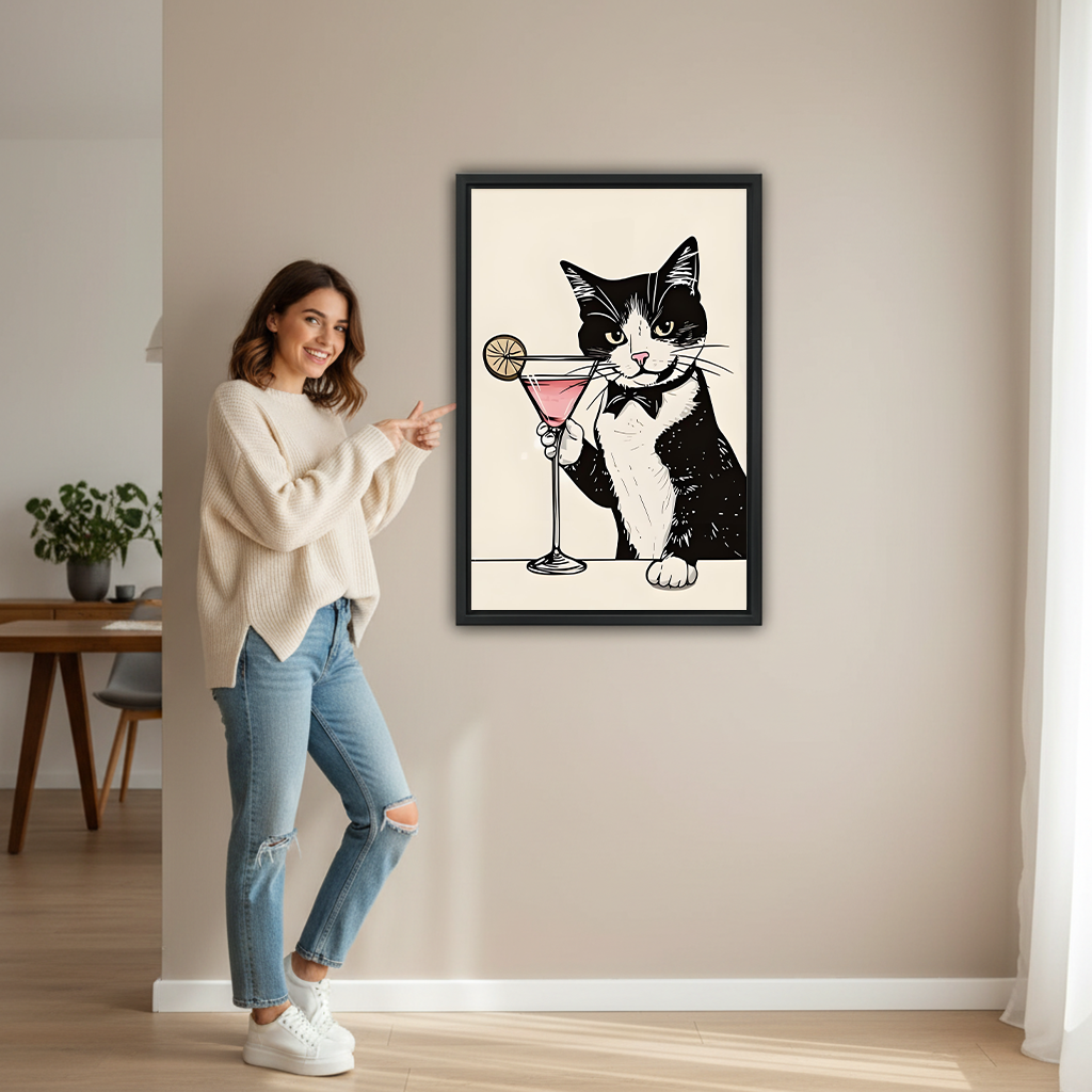 Smiling woman pointing at large tuxedo cat martini framed print on beige wall to show size in modern hallway