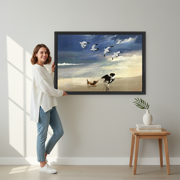 Woman holding large framed beach dogs seagulls canvas wall art