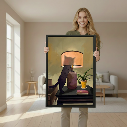 Woman holding large vintage black cat lamp framed print in bright Scandinavian style interior