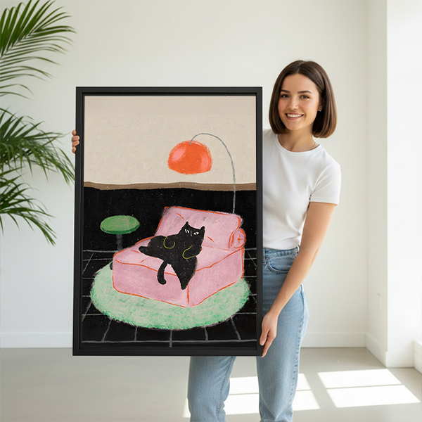 Woman holding large mid-century black cat framed canvas art size reference