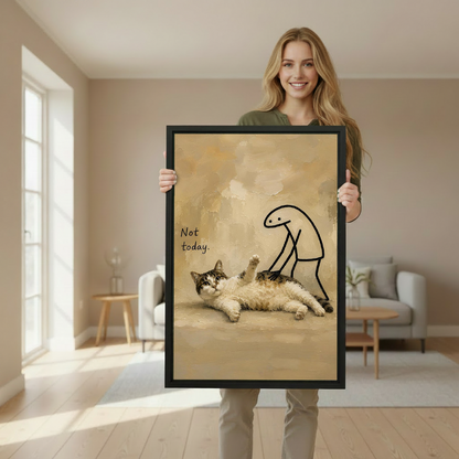 Woman holding a large framed 'Not Today' whimsical cat oil painting wall art print in a bright neutral living room