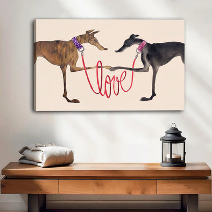 Two greyhounds with red love leash canvas wall art, frameless gallery wrap, whimsical dog love illustration cream background, hung above a wooden console table with lantern in a bright minimalist entryway
