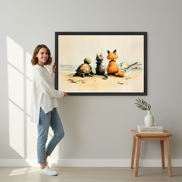 Smiling brunette woman in white sweater and jeans holding large turtle cat fox bird beach vintage illustration framed canvas print against light grey wall beside wooden stool with white vase and palm leaf