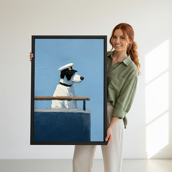 Woman holding a large framed nautical dog art print featuring a captain dog on a ship deck