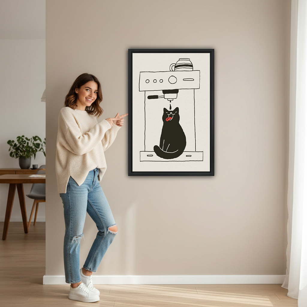 Smiling brunette woman in cream sweater and ripped jeans pointing at funny black cat espresso machine minimalist line art framed canvas print hung on beige wall in bright hallway with wooden dining table dark chair and green plant