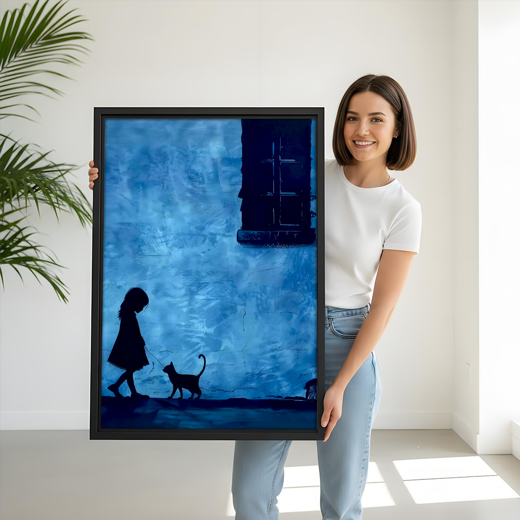 Woman holding large blue silhouette girl and cat framed art print showing size scale against white background