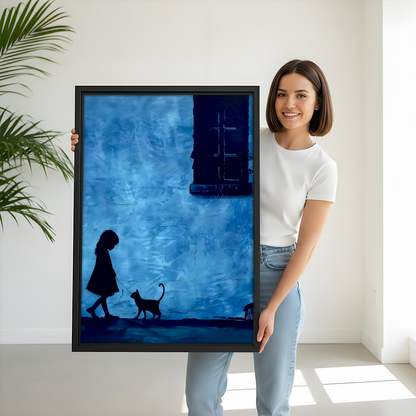 Woman holding large blue silhouette girl and cat framed art print showing size scale against white background