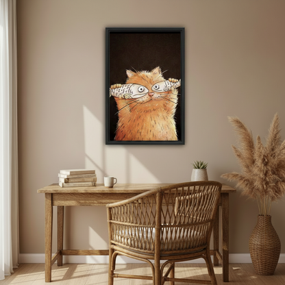 Whimsical orange cat fish art print in black frame above home office desk