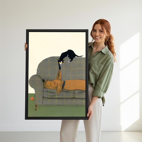 Woman holding a large framed cat and dog art print, whimsical illustrated wall art perfect as a pet lover gift