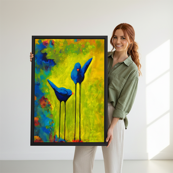 Woman holding large two blue birds colorful framed canvas wall art print showing size reference
