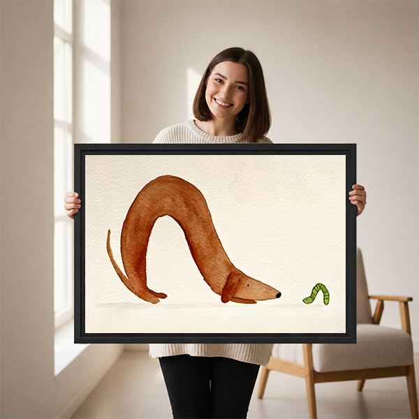 Smiling woman holding large framed curious dachshund caterpillar watercolor wall art print size reference