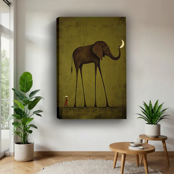 Black-framed elephant moon canvas wall art beside a rattan bed with rust-colored bedding and a sage wall.