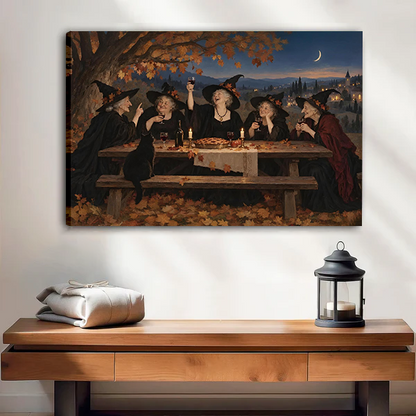 Unframed vintage witches feast canvas wall art above a wooden console with folded blankets and a black lantern.