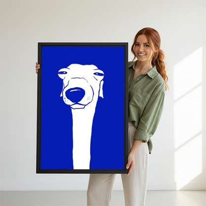 Woman holding large greyhound bold blue minimalist framed canvas print showing size reference in bright white studio