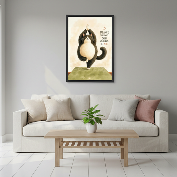 Yoga cat motivational quote framed wall art in black frame above cream sofa in minimalist living room