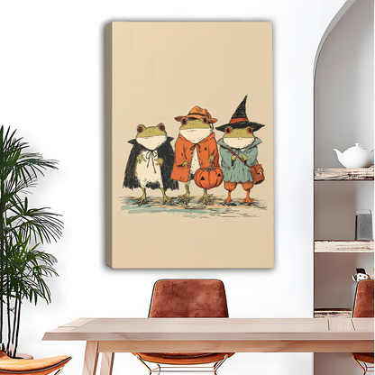 Framed whimsical Halloween frogs canvas wall art with a pumpkin bucket above a wooden dining table.