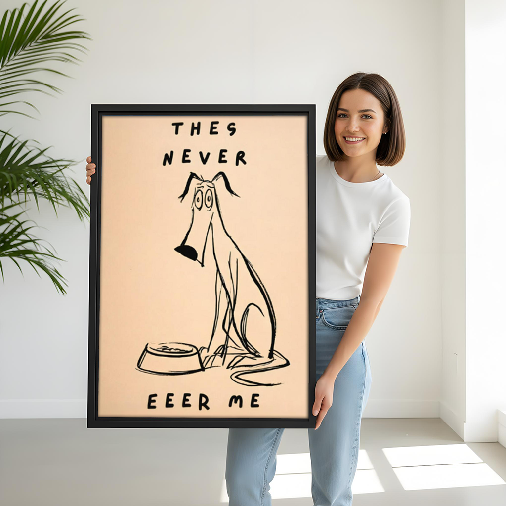 Woman holding large funny dog framed art print with They Never Feed Me quote, size reference for pet lover decor