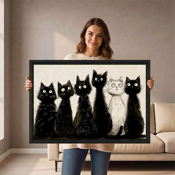 Woman holding large framed black and white cats sketch wall art print size reference