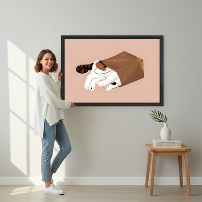 Woman holding large framed canvas print of playful cat in brown paper bag minimalist blush pink wall art