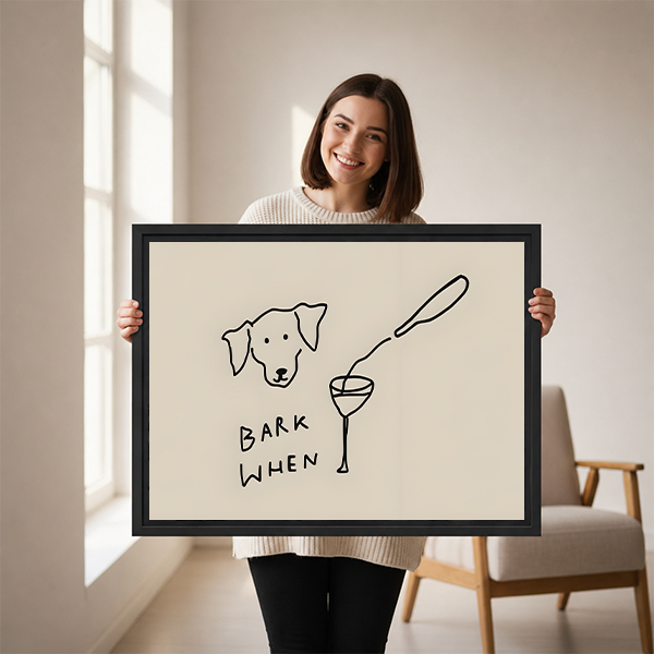 Smiling woman holding large funny dog Bark When wine minimalist framed canvas print to show size in bright room with armchair