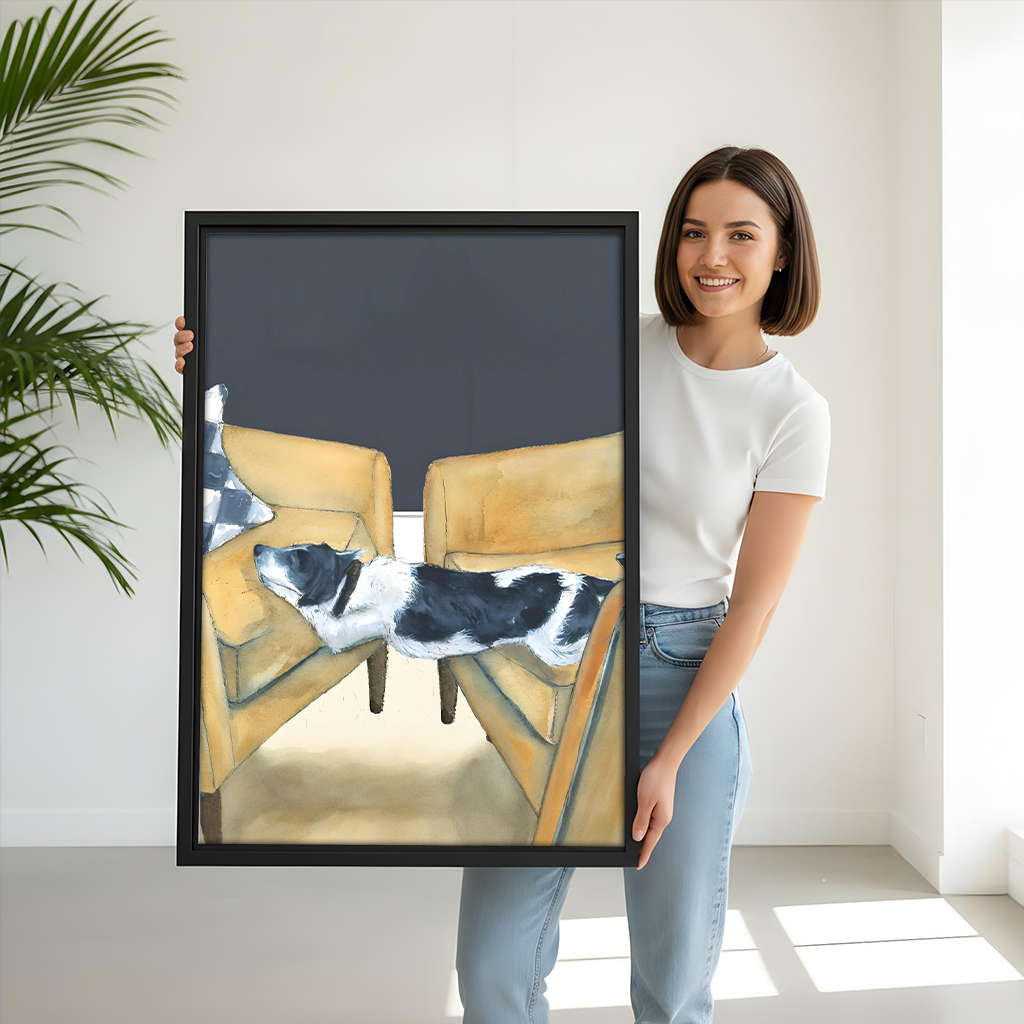Woman holding large funny dog framed art print showing black and white dog on yellow armchairs size reference
