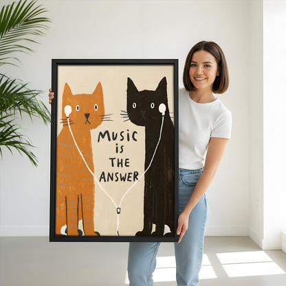 Woman holding large music cat pop art framed print showing size scale with orange and black cats on earphones