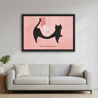 Minimalist black cat Don't Touch Me framed wall art above a light gray sofa in a bright Scandinavian living room