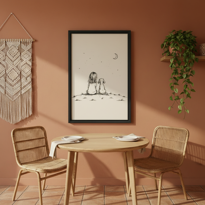 Charming girl and dog hillside stargazing crescent moon minimalist sketch wall art print in black frame on terracotta wall above rattan dining table and chairs with macrame wall hanging in boho dining room

