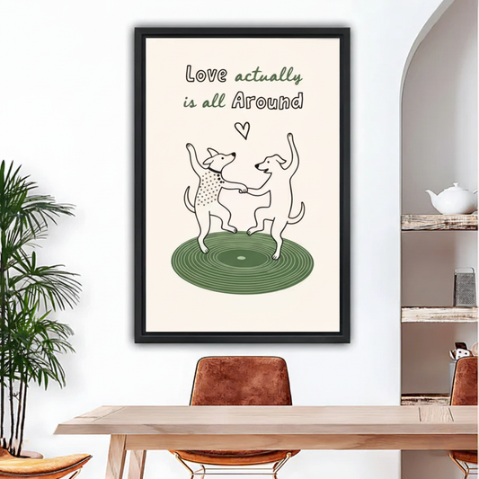 Dancing dogs "Love Actually Is All Around" framed wall art print hanging above dining table, minimalist line art style