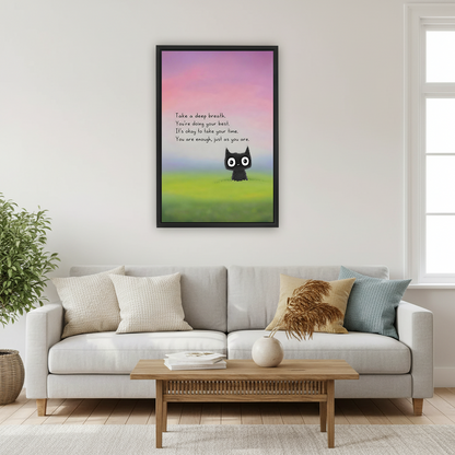 Framed cute black cat inspirational quote canvas wall art print above white sofa in bright living room