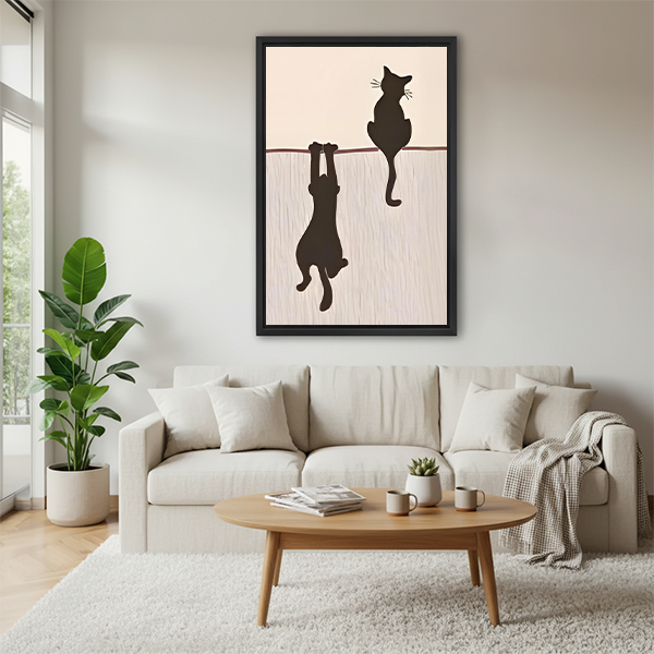 Playful black cat duo hanging silhouette framed wall art above white sofa in Scandinavian living room