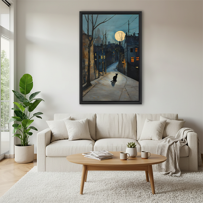 Black cat moonlit street framed watercolor print above a cream sofa in a Scandinavian living room, moody night scene wall art