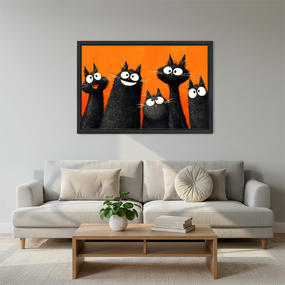 Five fluffy black cats with wild white eyes on bold orange background pop art oil painting style framed wall art hung on grey wall above light grey sofa with round cushion wooden coffee table and small green plant in Scandinavian living room