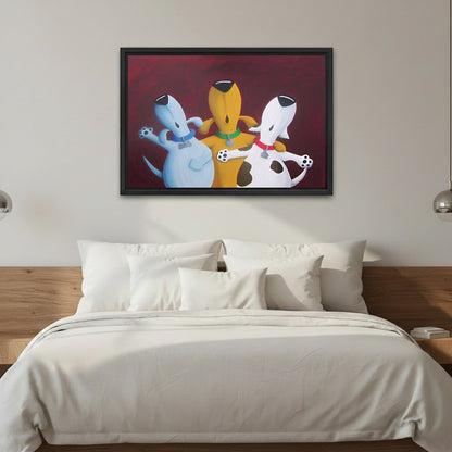 Whimsical three dogs best friends framed canvas wall art, blue yellow white cartoon dogs hugging, deep red background, black frame, above white linen bed with silver sconces