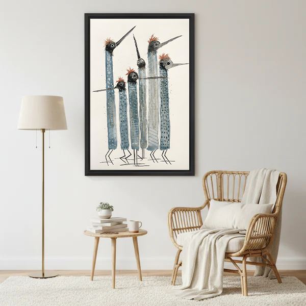 Five tall abstract blue grey tribal birds with red fluffy crests long pointed beaks and dot texture patterns folk art hand-drawn illustration on aged cream background framed wall art hung on light grey wall beside rattan wingback armchair with cream throw blanket white linen cushion round wooden side table with stacked books white mug small succulent and brass gold floor lamp