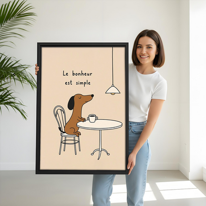 Framed dachshund coffee line art canvas hanging above a grey sofa with blue cushions and a wooden table