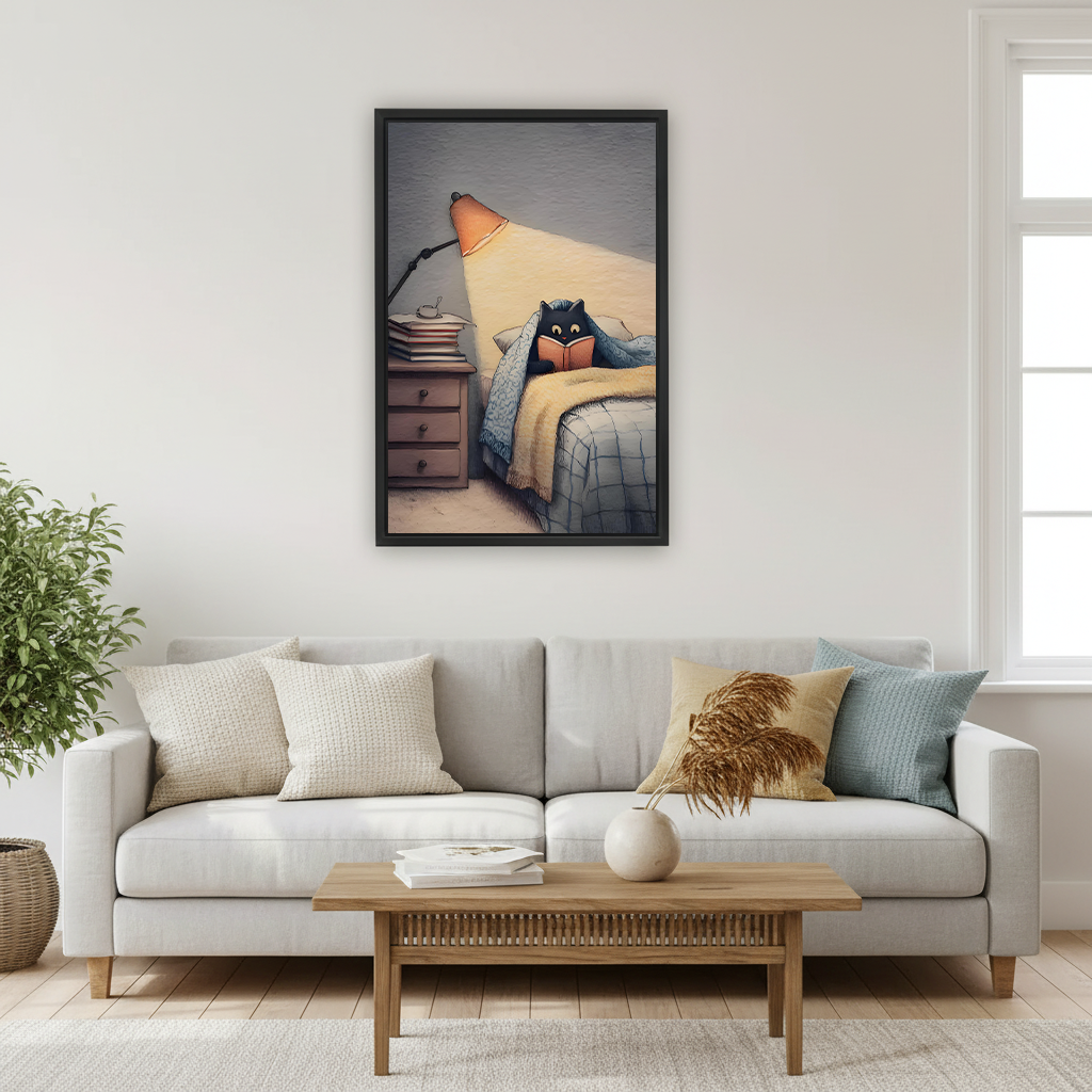 Black cat reading under blanket by lamplight cozy illustration framed wall art hung on white wall above cream sofa with linen cushions and wooden coffee table in Scandinavian living room

