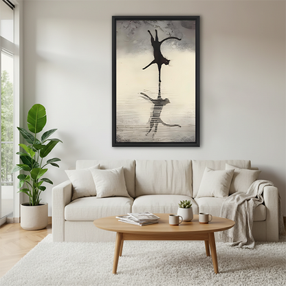 Black framed cat leaping with lion reflection above a cream sofa in a Scandinavian living room, minimalist animal wall art